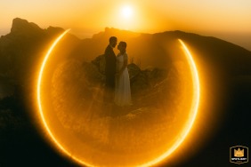 Beautiful wedding portrait of a bride and groom on their special day in Mallorca Island, Spain. The golden hour sunlight casts a warm, glowing halo around the couple, capturing the love and joy of their celebration.